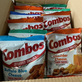 Box containing multiple packages of Combos stuffed snacks in various flavors.